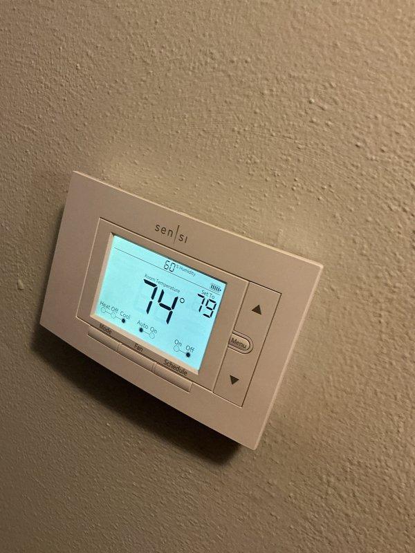 Performed a heating tune-up on a 9-year-old Lennox furnace, inspecting the unit cabinet and components for signs of frost, rust, or damage, with none found. Replaced the 20x25x1 pleated return air filter and verified the Sensi thermostat is operating properly and in good condition. The system was left in proper working order.