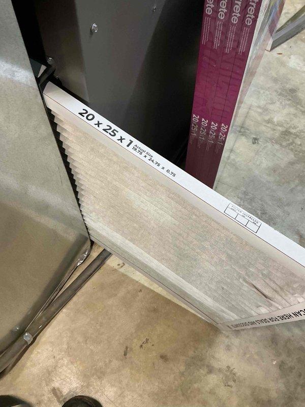 Performed a seasonal tune-up on a 4-year-old gas furnace serving a single-unit system. Removed the dust-loaded and discolored 20x25x1 pleated return air filter and installed a new replacement filter. Inspected the Honeywell whole-home humidifier and found the housing clean and intact, with no visible rust, cracks, or damage.