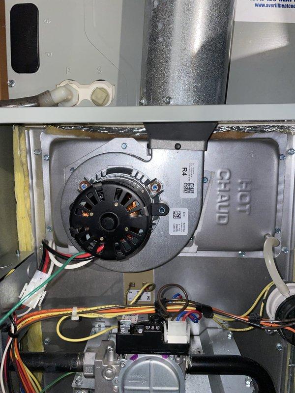 Replaced the failed draft inducer motor on the gas furnace with a new unit, reinstalling the mounting gasket and securing the assembly to the blower housing. Verified wiring connections and flue connection were intact, and confirmed proper inducer operation and furnace startup sequence upon completion. The removed motor was discarded.