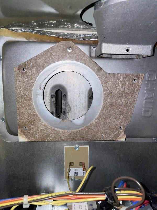 Replaced the failed draft inducer motor on the gas furnace with a new unit, reinstalling the mounting gasket and securing the assembly to the blower housing. Verified wiring connections and flue connection were intact, and confirmed proper inducer operation and furnace startup sequence upon completion. The removed motor was discarded.