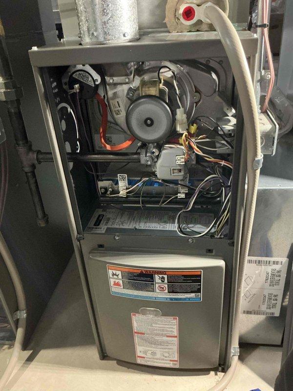 Performed heating tune-ups on two 7-year-old Lennox gas furnaces, inspecting the inducer motor, pressure switch, gas valve and piping, wiring harness, and control components. Both units were found clean and in normal operating condition with no signs of rust, damage, or leaks, and the associated ductwork and refrigerant line components were checked for proper condition.