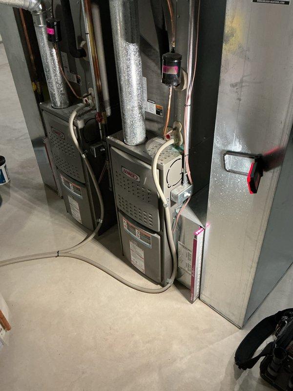 Performed heating tune-ups on two 7-year-old Lennox gas furnaces, inspecting the inducer motor, pressure switch, gas valve and piping, wiring harness, and control components. Both units were found clean and in normal operating condition with no signs of rust, damage, or leaks, and the associated ductwork and refrigerant line components were checked for proper condition.
