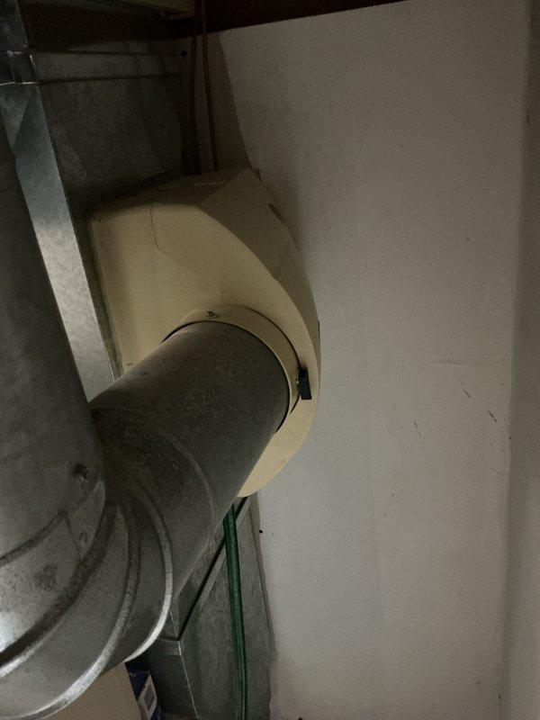 Performed a heating tune-up on one unit, including inspection of the galvanized supply ductwork and connections, with no signs of damage, corrosion, or frost noted. Inspected the media air cleaner and found the pleated filter heavily loaded with dust and debris, indicating it is due for replacement. Verified the Aprilaire control unit is operational with its display and indicator lights functioning.