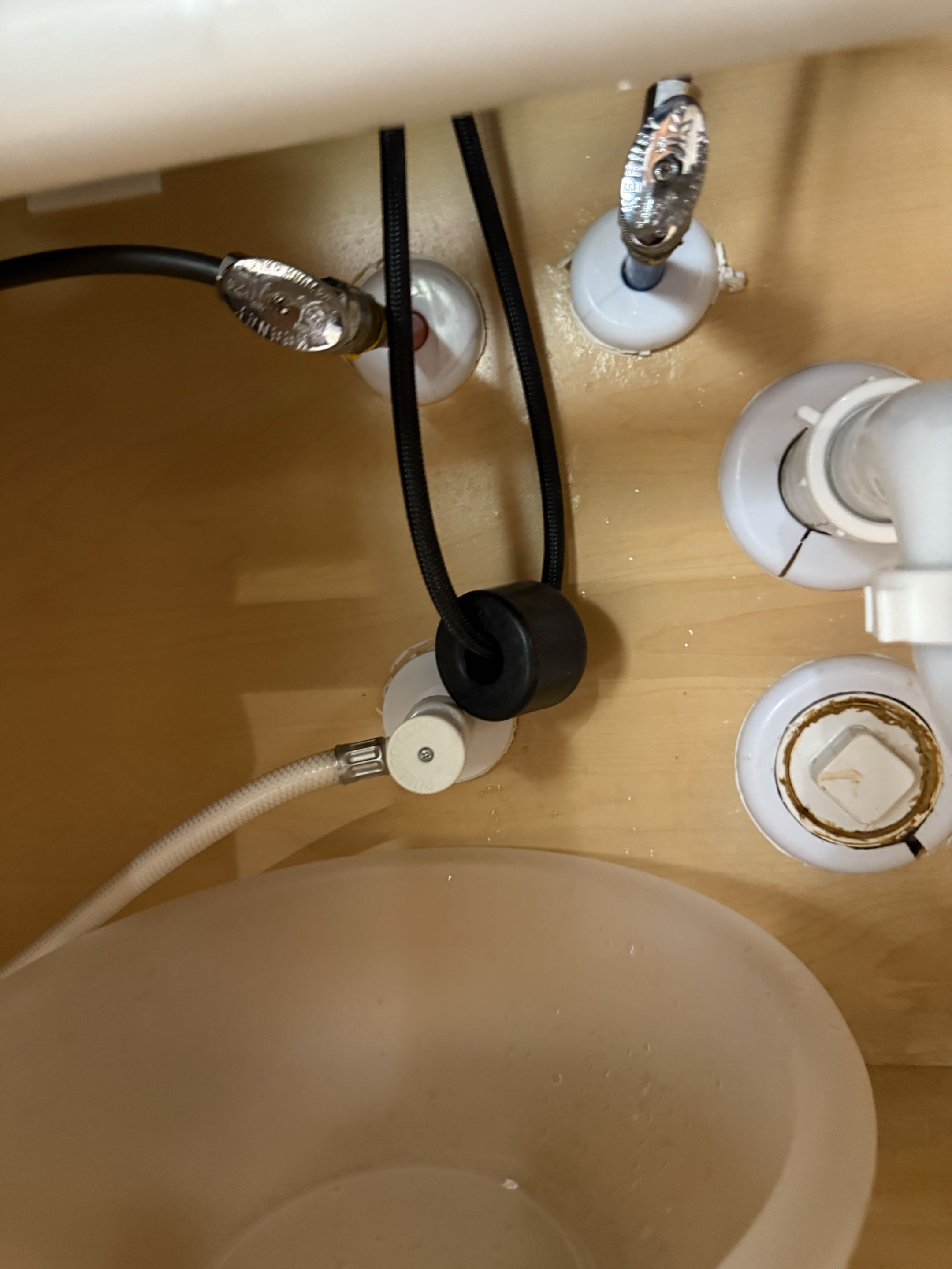 Upon arrival, I inspected the kitchen sink area and found no active leak at the time. However, the customer reported water spraying from beneath the sink. I examined all water and drain connections thoroughly. The kitchen faucet was around 10 years old, and the shut-off valves and supply lines were approximately 15 years old, showing visible signs of wear. I discussed potential repair and replacement options with the customer, focusing on under-sink components. Additionally, I recommended preventative whole-home protection solutions to avoid future issues. The customer was informed about the benefits of updating the aged components to ensure long-term reliability and prevent potential leaks.