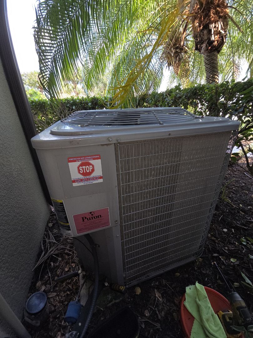 Perform maintenance on Carrier air conditioner.