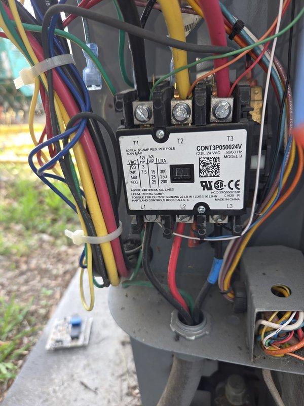 Replaced failed contactor (CONT3P050024V, 24V AC coil) and defrost control board on outdoor heat pump unit. Transferred all electrical connections to new contactor, ensuring proper wire routing and secure terminations across all three poles. Verified system startup, confirmed contactor engagement during compressor call, and tested defrost cycle operation to ensure all components functioning correctly.