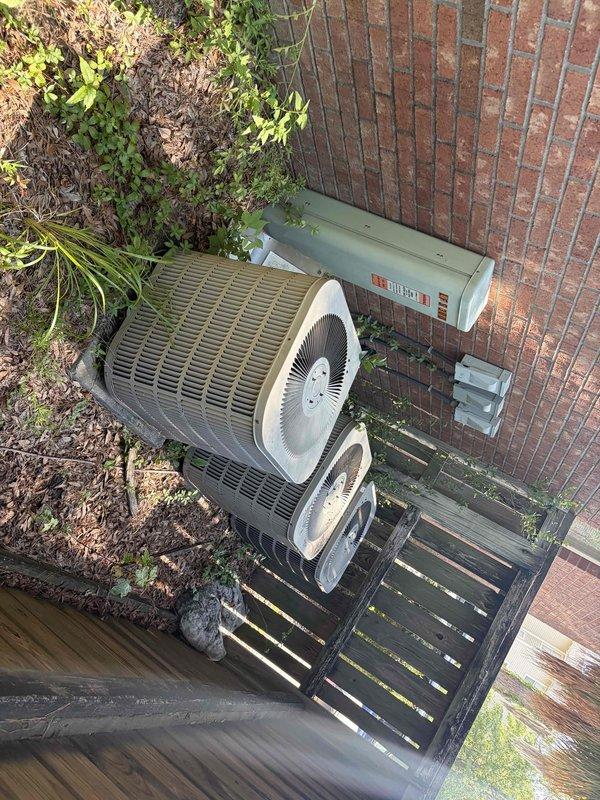 Conducted site assessment for replacement of 20 HVAC units across multifamily property locations. Inspected existing condensing units at first property, documenting multiple outdoor installations including units positioned on wooden platforms and along building exterior walls. Evaluated electrical disconnect boxes, conduit routing, and existing pad conditions. Initial site visit completed in preparation for comprehensive replacement quote, with second property location to be assessed following customer coordination.