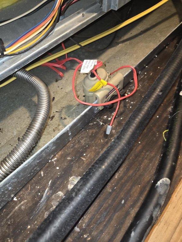 Responded to service call for HVAC system leak in attic causing water damage to interior ceiling with puddle formation on floor below. Performed diagnostic inspection of attic-mounted air handler and associated components. Identified primary condensate drain line blockage causing overflow from drain pan. Inspected evaporator coil, drain pan, and secondary emergency drain line for proper operation. Verified condensate pump functionality and cleared obstruction from primary drain line. Checked exterior drainage termination point and confirmed proper water discharge. System tested and operational with condensate flowing freely through drain system. Recommended monitoring for recurrence and scheduling routine maintenance to prevent future blockages.