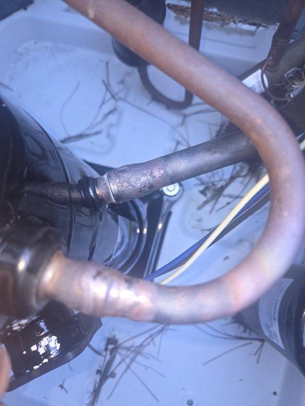 Completed full compressor replacement on Unit #5306, a 1.5-ton single-phase R-410A system. Recovered existing refrigerant charge using on-truck recovery machine and removed the failed compressor. Installed new 1.5-ton R-410A compressor along with a new liquid line drier. Brazed all refrigerant connections and performed pressure test to verify system integrity with no leaks detected. Pulled deep vacuum on the system to remove moisture and contaminants. Recharged system to manufacturer specifications with 8 lbs of R-410A refrigerant and added acid neutralizer to address residual contamination from the compressor failure. Started system and verified proper operation. Recorded final operating parameters including superheat, subcooling, compressor amp draw, and supply/return air temperatures—all readings within acceptable range confirming successful repair.