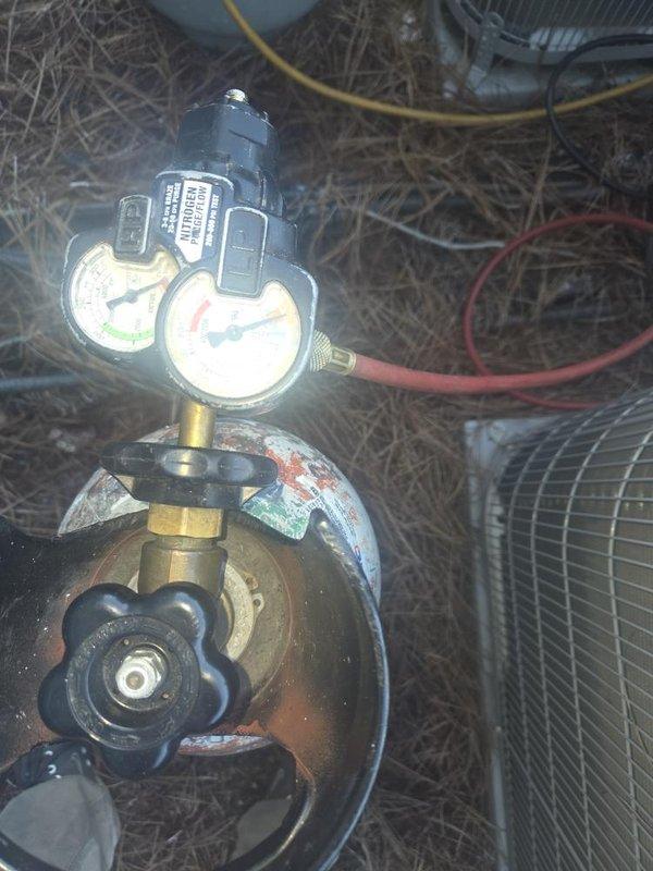 Completed full compressor replacement on Unit #5306, a 1.5-ton single-phase R-410A system. Recovered existing refrigerant charge using on-truck recovery machine and removed the failed compressor. Installed new 1.5-ton R-410A compressor along with a new liquid line drier. Brazed all refrigerant connections and performed pressure test to verify system integrity with no leaks detected. Pulled deep vacuum on the system to remove moisture and contaminants. Recharged system to manufacturer specifications with 8 lbs of R-410A refrigerant and added acid neutralizer to address residual contamination from the compressor failure. Started system and verified proper operation. Recorded final operating parameters including superheat, subcooling, compressor amp draw, and supply/return air temperatures—all readings within acceptable range confirming successful repair.