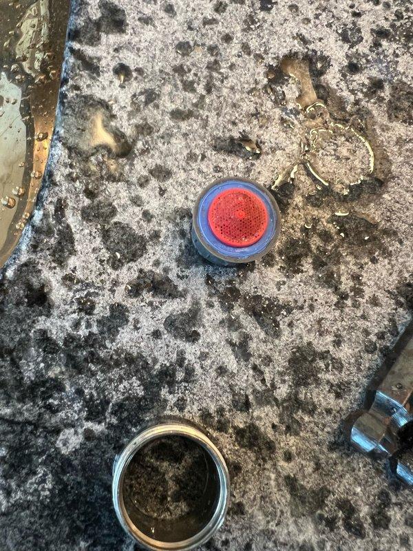 Responded to multiple plumbing concerns including a non-functional exterior water faucet, sewage odor emanating from the downstairs bathroom in the garage/mechanical room area, and a temperature control issue in the master bathroom tub where only hot water was available. Upon inspection, diagnosed the exterior faucet for potential valve failure or freeze damage, investigated the sewer gas smell by examining drain traps and vent system components in the affected bathroom area, and assessed the tub's mixing valve for malfunction preventing cold water flow. Documented existing conditions with photographic evidence showing drain components and surrounding fixtures for reference and potential follow-up repairs.
