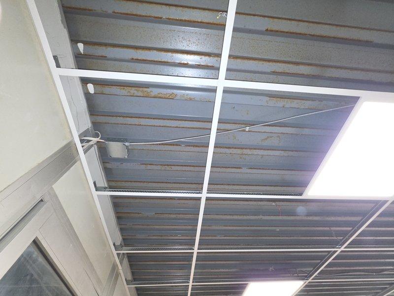 Removed and replaced accessible existing Romex wiring serving the break room lighting with MC cable to meet current code requirements. Completed wiring and final connections for six remaining light fixtures, then tested all lighting circuits to verify proper operation upon completion.