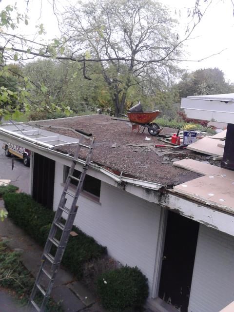 Setting up to tear off flat roof and install new modified bitumen roofing system. Setting up to tear off flat roof and install new modified bitumen roofing system.