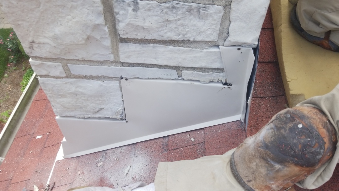 Reglet chimney flashing on a new roof repair we recently did. Reglet chimney flashing on a new roof repair we recently did.