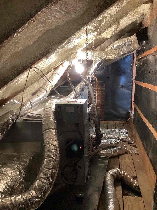 Completed comprehensive inspection of HVAC system in crawlspace/attic area, focusing on the condition of flexible ductwork and air handler unit. Verified integrity of black insulation covering on all distribution pipes, checked connections at branch points, and confirmed proper installation of the central air handler with associated wiring. Documentation photos taken of the complete system for service records.