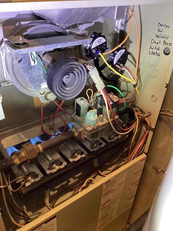 Replaced malfunctioning dual pressure switch on residential gas furnace system. Verified proper operation of all safety controls and tested system functionality after installation. Customer was invoiced for completed repair service.