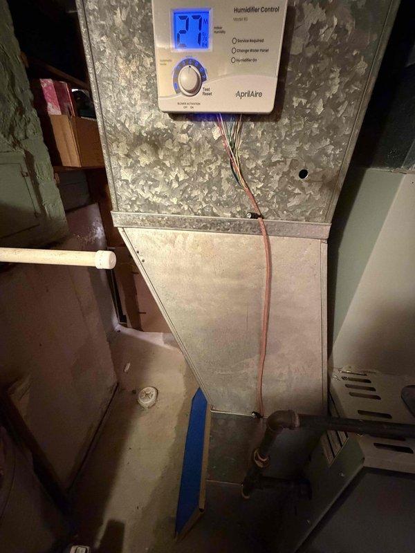 Successfully completed AprilAire 720A humidifier replacement on existing HVAC system, including installation of digital control panel showing proper temperature readings. All connections were properly secured, wiring was completed according to manufacturer specifications, and system was tested to ensure optimal performance.