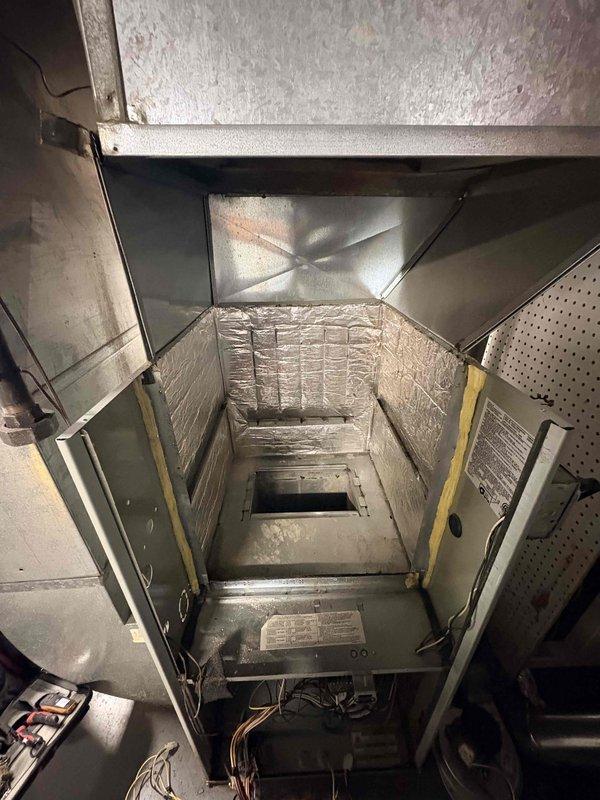 Replaced defective heat exchanger on HVAC unit under parts and labor warranty. Observed significant dirt accumulation on evaporator coils and rust formation on the metal housing during service. Removed failed component and returned to office for warranty processing.