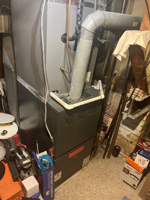 Performed diagnostic assessment on 20-year-old furnace system that was blowing cool air instead of heat. Inspection of the Goodman unit revealed significant wear and deterioration of critical components, with improper exhaust venting observed. Recommended complete system replacement due to age, efficiency concerns, and repair costs exceeding replacement value.