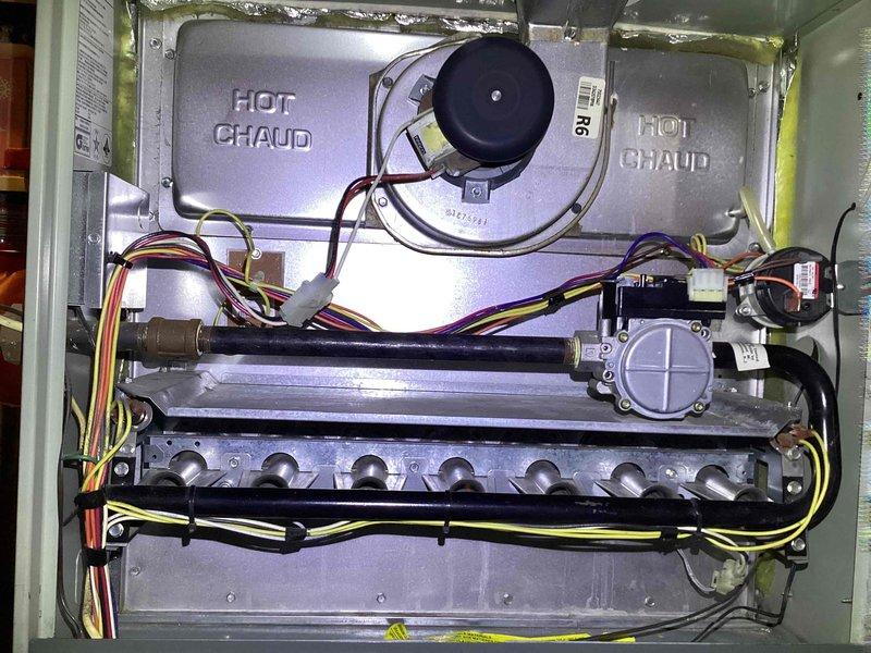 Diagnosed and serviced 17-year-old furnace with malfunctioning blower. Performed electrical testing with clamp meter on the blower motor capacitor, replaced faulty component, and verified proper operation of the gas valve and burner assembly.