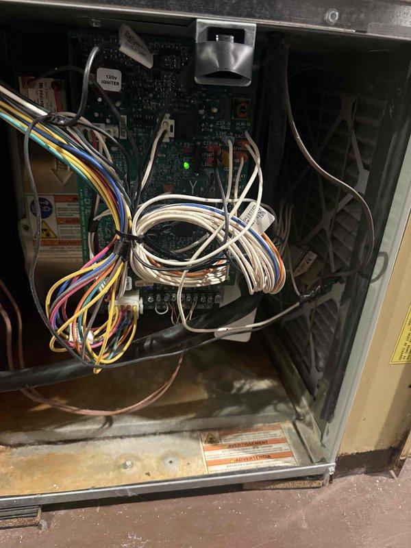 Responded to service call for furnace repeatedly tripping circuit breaker. Performed diagnostic inspection of electrical components, including examination of internal wiring connections and control board functionality. Identified and repaired faulty wiring connection at terminal block that was causing intermittent short circuit, restoring proper operation to the heating system.