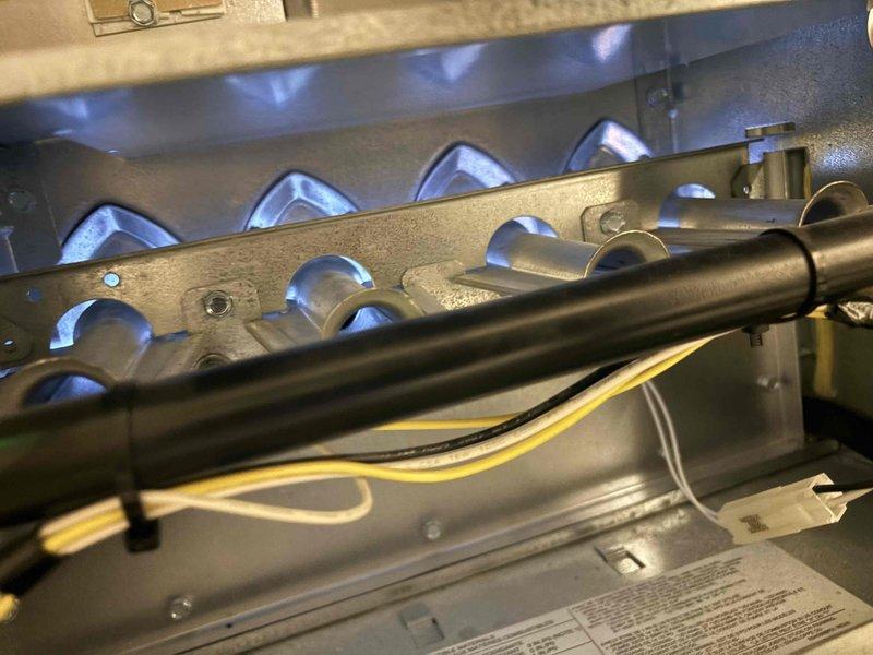 Responded to no-heat service call where customer reported inadequate heating on first floor with air from vents not feeling warm. Upon inspection, discovered furnace was operational with proper burner ignition showing normal blue flame pattern. Visual inspection of the mechanical room revealed no obvious external issues with the furnace unit, ductwork, or associated components. Diagnosed and confirmed system was functioning correctly, with customer educated on proper operation.