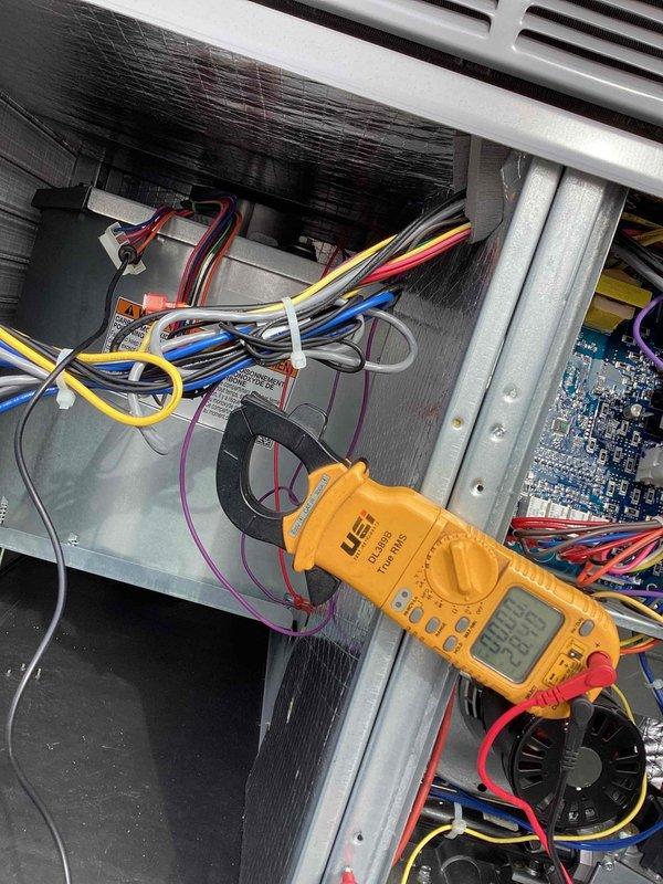 Completed warranty service on Carrier RTU by replacing failed blower motor. Performed electrical testing with UEi clamp meter, verifying proper current readings of 297.6 and inspecting wiring connections. Checked system for airflow restrictions that could have contributed to motor failure; none were found.