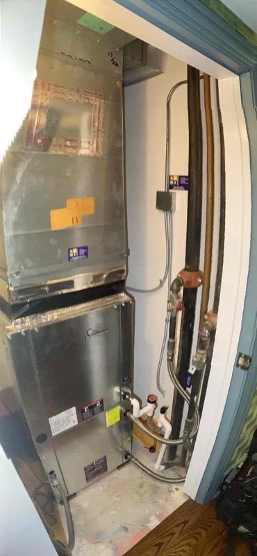 Performed comprehensive Clean and Check service on a heat pump system located in a utility closet. Inspected all components of the HVAC installation including ductwork, refrigerant lines, and electrical connections. Temperature readings verified system is operating at 51.5°F, confirming proper cooling performance according to manufacturer specifications.