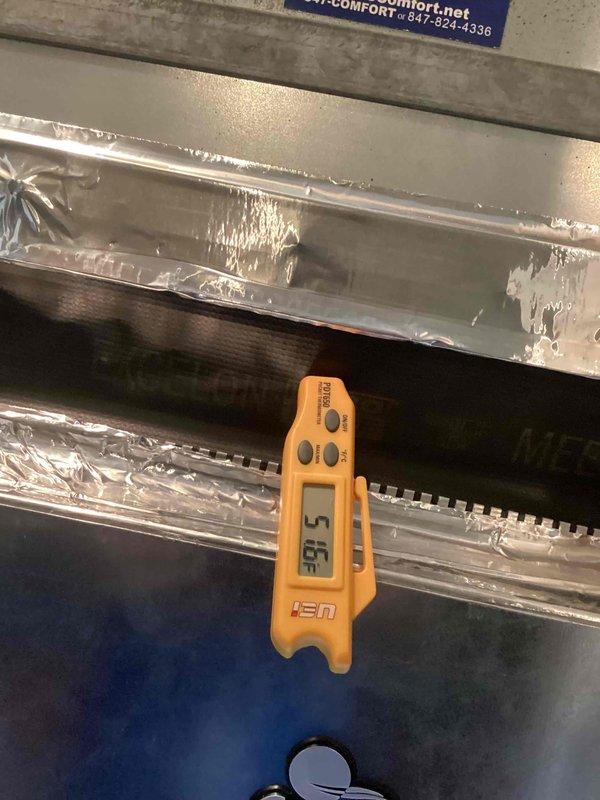 Performed comprehensive Clean and Check service on a heat pump system located in a utility closet. Inspected all components of the HVAC installation including ductwork, refrigerant lines, and electrical connections. Temperature readings verified system is operating at 51.5°F, confirming proper cooling performance according to manufacturer specifications.