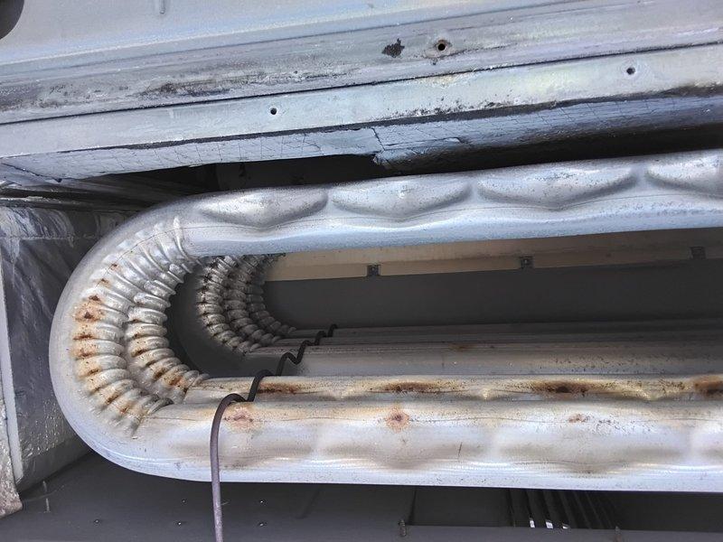 Performed comprehensive Clean and Check service on three systems: two split system AC/air handlers and one rooftop unit. Inspected evaporator coils showing signs of corrosion and age-related wear, and examined electrical components including circuit boards and motor connections. Replaced four filters: two 16x20x1 and two 16x25x2.