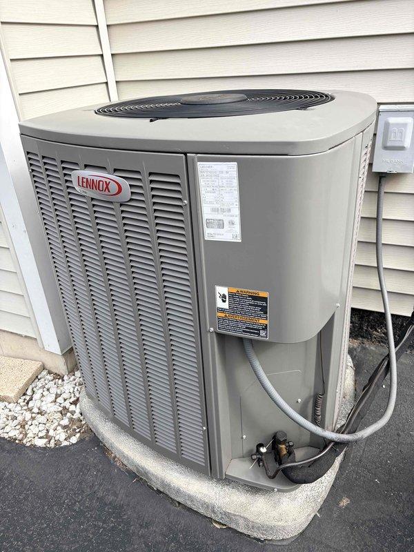 Performed annual Clean and Check on Lennox AC system per Comfort Plan. Inspected outdoor condensing unit installed on concrete pad with proper clearance and drainage. Examined indoor components including furnace with PVC venting and associated ductwork in mechanical room. All systems functioning within normal parameters with no issues detected.