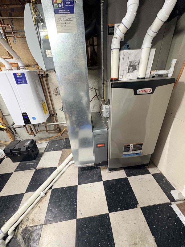 Performed annual Clean and Check on Lennox AC system per Comfort Plan. Inspected outdoor condensing unit installed on concrete pad with proper clearance and drainage. Examined indoor components including furnace with PVC venting and associated ductwork in mechanical room. All systems functioning within normal parameters with no issues detected.