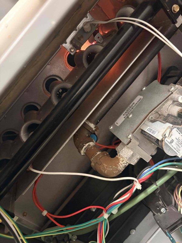 Performed Clean and Check service on HVAC system per Comfort Plan agreement. Inspected furnace components, finding significant buildup on evaporator coil/humidifier pad requiring thorough cleaning. Serviced two furnaces, one tankless water heater, and two humidifiers according to maintenance protocol.