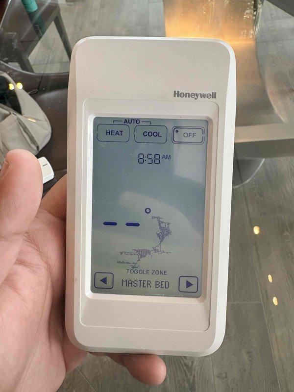 Diagnosed and replaced malfunctioning Honeywell zoned thermostat in master bedroom that was experiencing operational issues. Installed new batteries and verified proper communication between the thermostat and HVAC system. System now functioning correctly with all temperature control modes operational.