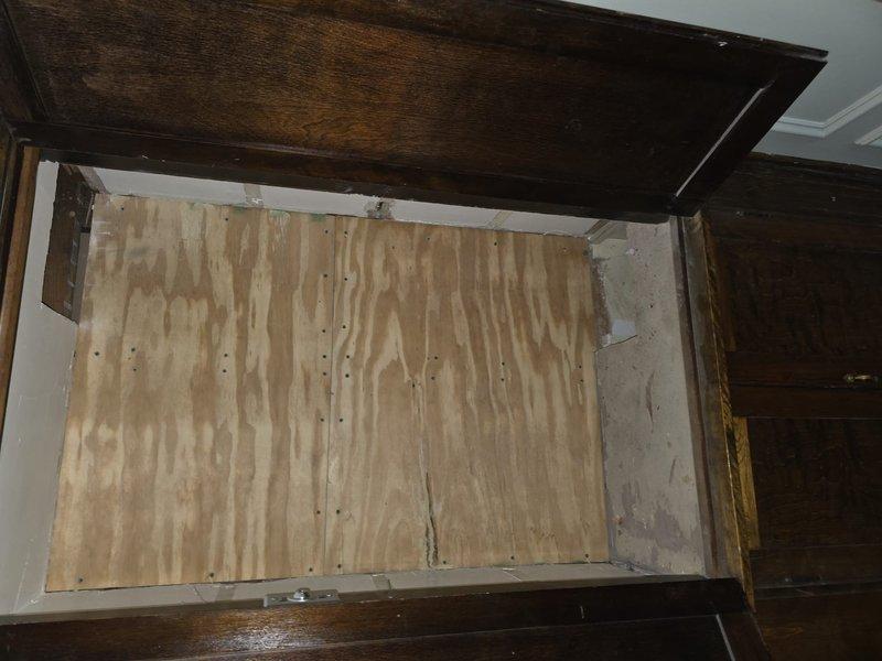 Conducted site assessment of de-roof construction to evaluate HVAC integration requirements. Inspected newly installed plywood panels within wooden framework and examined exposed interior framing structure with multiple levels of unfinished lumber studs and joists. Documented current construction phase with photographs to develop appropriate HVAC system installation plan.