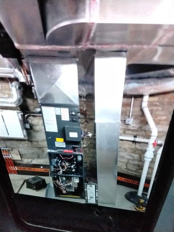 Completed installation of a new Lennox SLP99V communicating gas furnace with modulating valve and variable speed blower in basement to serve 1st floor and basement areas. Installation included new PVC exhaust/intake flue system, Lennox media filter cabinet, S40 communicating thermostat, and 3/4" PVC condensation drain line connected to existing floor drain. System was properly started up, tested, and all final adjustments were made to ensure optimal performance.