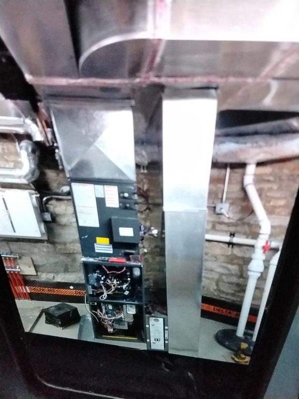 Completed installation of a new Lennox SLP99V communicating gas furnace with modulating valve and variable speed blower in basement to serve 1st floor and basement areas. Installation included new PVC exhaust/intake flue system, Lennox media filter cabinet, S40 communicating thermostat, and 3/4" PVC condensation drain line connected to existing floor drain. System was properly started up, tested, and all final adjustments were made to ensure optimal performance.