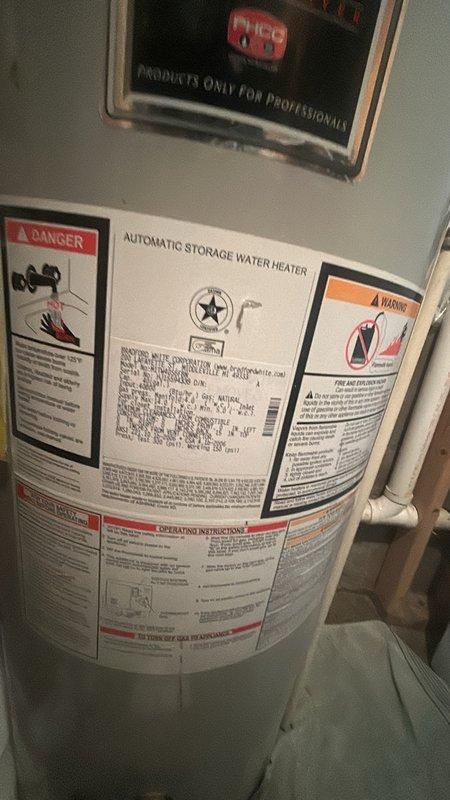 Conducted a detailed estimate for replacement of a 40-gallon PVC-vented water heater in basement utility area. Inspected existing unit showing age-related wear and documented current installation including venting configuration and connection points. Explained permit requirements and applicable customer discount, though clarification was needed regarding initial permit information provided.
