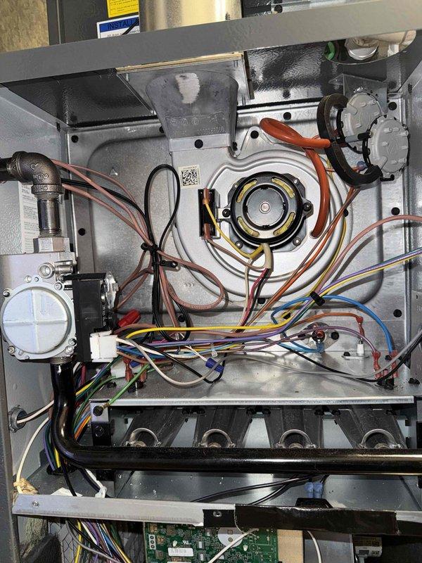 Performed comprehensive Clean and Check service on a dual system setup including furnace, water heater, and humidifier per customer's Comfort Plan agreement. Inspected furnace blower assembly, electrical connections, and control components, ensuring all wiring was secure and properly connected. Examined Bradford White water heater installation, verifying proper ventilation duct connection and inspecting copper piping and brass fittings for leaks or signs of wear.