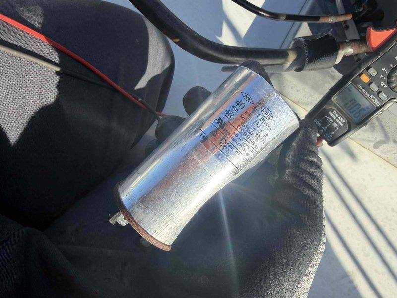 Performed routine maintenance on AC CNC unit. Inspected blower wheel assembly and checked capacitor with multimeter. Tested system operation and verified all components are functioning within specifications.