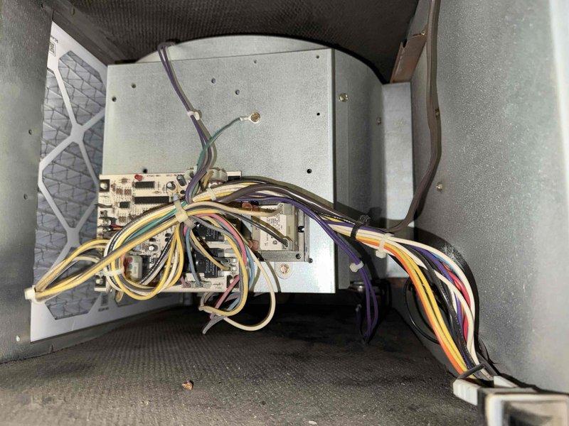 Performed routine maintenance on commercial AC unit (201) under service agreement. Inspected control board circuitry and wire connections, noting all connections secure with no signs of overheating. Examined pipe junctions and seals in the mechanical assembly, confirming proper sealing compound at connection points with no evidence of leaks.