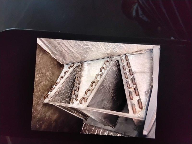 Performed preventive maintenance on two RTUs at vacant units 107/108. Identified frost accumulation on cooling coil and documented with measurements. Inspected interior duct components and air handler assembly for proper operation. Accessed property using lockbox code 0501 and returned key as instructed.