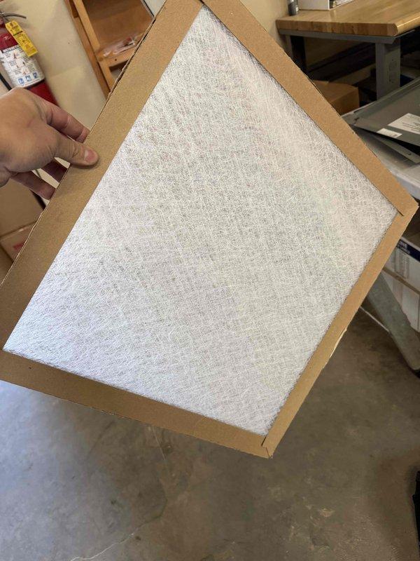 Performed routine maintenance on commercial ceiling-mounted HVAC system (AC CNC - unit 104), including inspection of the air handler, ductwork, and replacement of air filter. System is properly suspended with appropriate metal supports and all connections are secure.