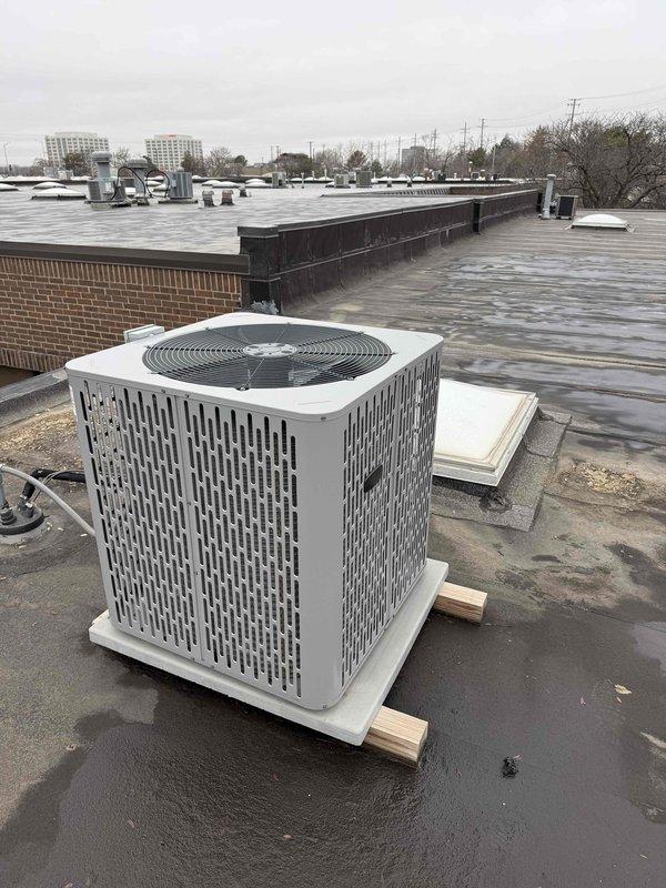 Performed spring commercial maintenance on vacant property after confirming entry permission. Completed maintenance checklist and documented equipment information, including a 14x30x1 return air filter. Inspected rooftop condenser unit which is properly elevated on blocks, and noted all equipment appears to be functioning normally with no issues identified.