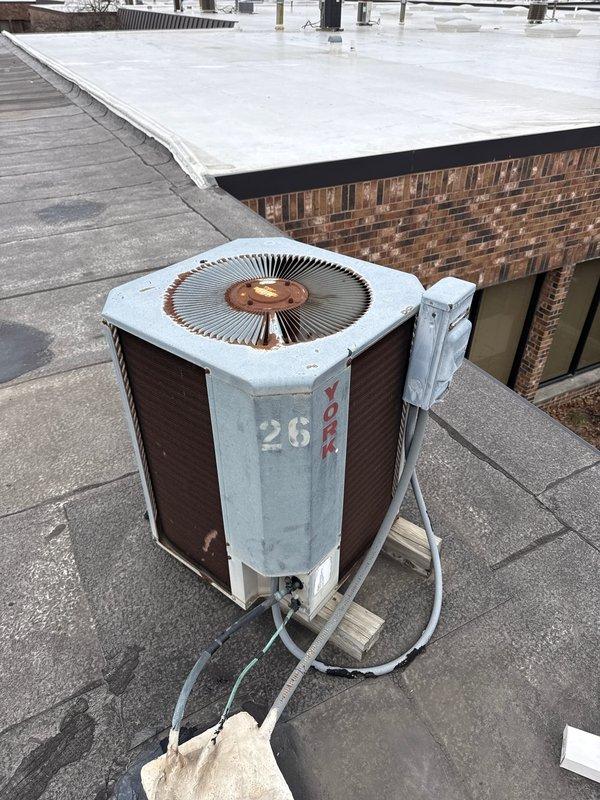 Performed scheduled commercial spring preventative maintenance on HVAC system. Completed comprehensive checklist documentation, inspected and serviced rooftop York condenser unit (#26) showing signs of weathering and roof-mounted furnace. Documented equipment specifications and filter requirements for system database update.