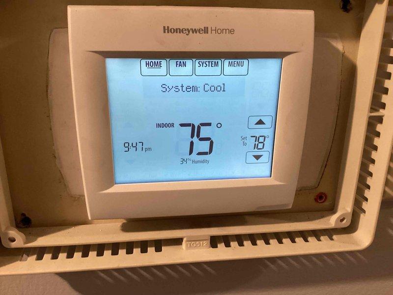 Performed scheduled Clean and Check maintenance service on one Carrier RTU. Inspected system components, replaced six 20x25x2 air filters, and verified proper operation with thermostat set to cooling mode at 78°F (current reading 75°F, 34% humidity). Left boilers operational per instructions. Secured roof access upon completion.
