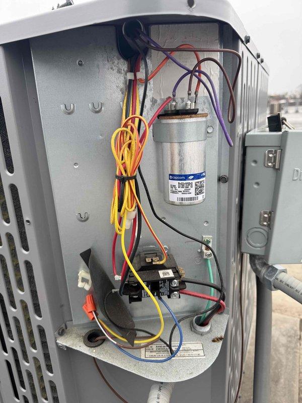 Performed spring commercial maintenance on vacant unit's HVAC system. Accessed equipment via lockbox (code 2424), completed comprehensive checklist inspection, and documented system components through photographs. Inspected electrical control compartment including capacitor, relays, and wiring connections, noting all components in functional condition.