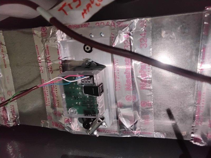 Completed installation of zone system control components, including wiring of dual humidifiers and connecting water lines. Installed circuit board modules within the ductwork and secured all control wiring with appropriate grommets and zip ties. Temporary thermostat installed for first floor system; second/third floor system requires 4×4 wall plate with center hole and grommet to properly cover thermostat wire box.