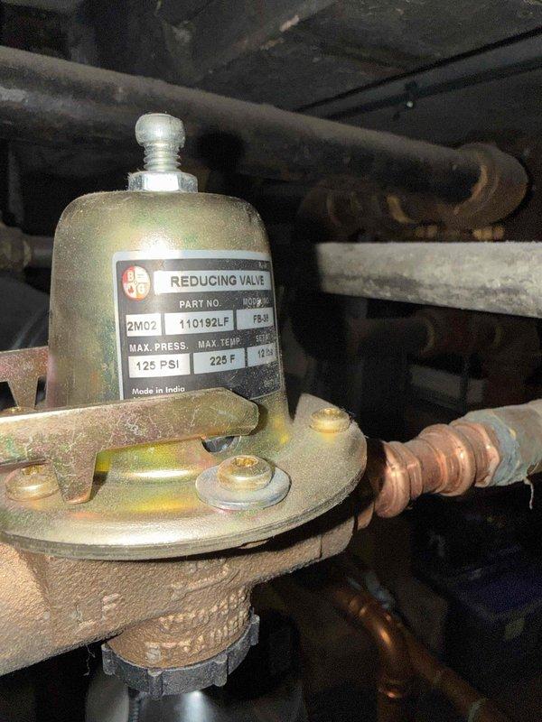 Performed boiler clean and check service that was overdue since 2023. Inspected water heater system and associated plumbing components, including a reducing valve rated for 125 PSI maximum pressure and 225°F maximum temperature. Documented condition of copper piping showing signs of normal aging and potential corrosion at connection points.