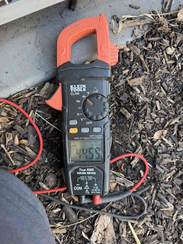 Performed Comfort Plan Clean & Check service on one AC system. Inspected outdoor condenser unit, which is installed on concrete pad adjacent to brick wall. Conducted amperage measurements with clamp meter, recording 44.5 amps. System operational and in good working condition.